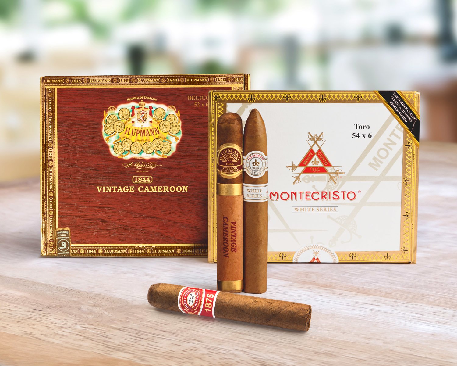 image of two boxes of cigars and three single cigars