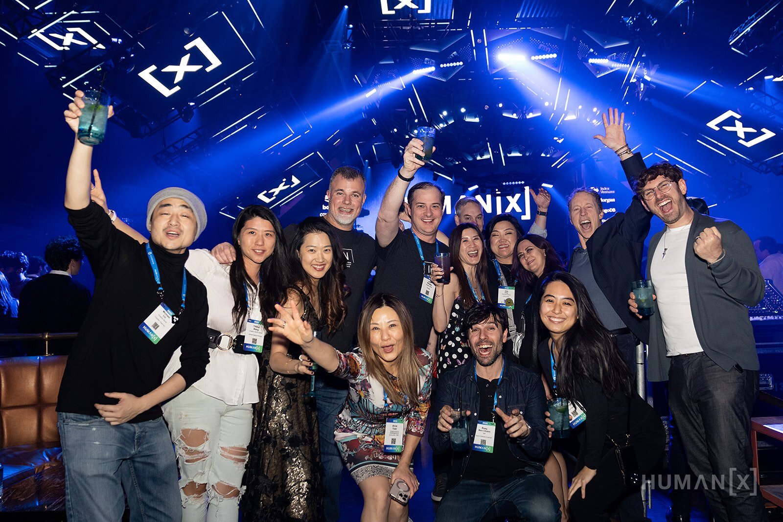 HumanX attendees cheer for the camera at the After Party
