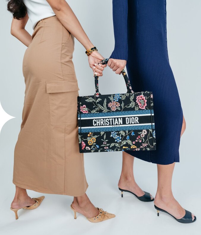 Photo of women holding a luxury bag from Vivrelle.