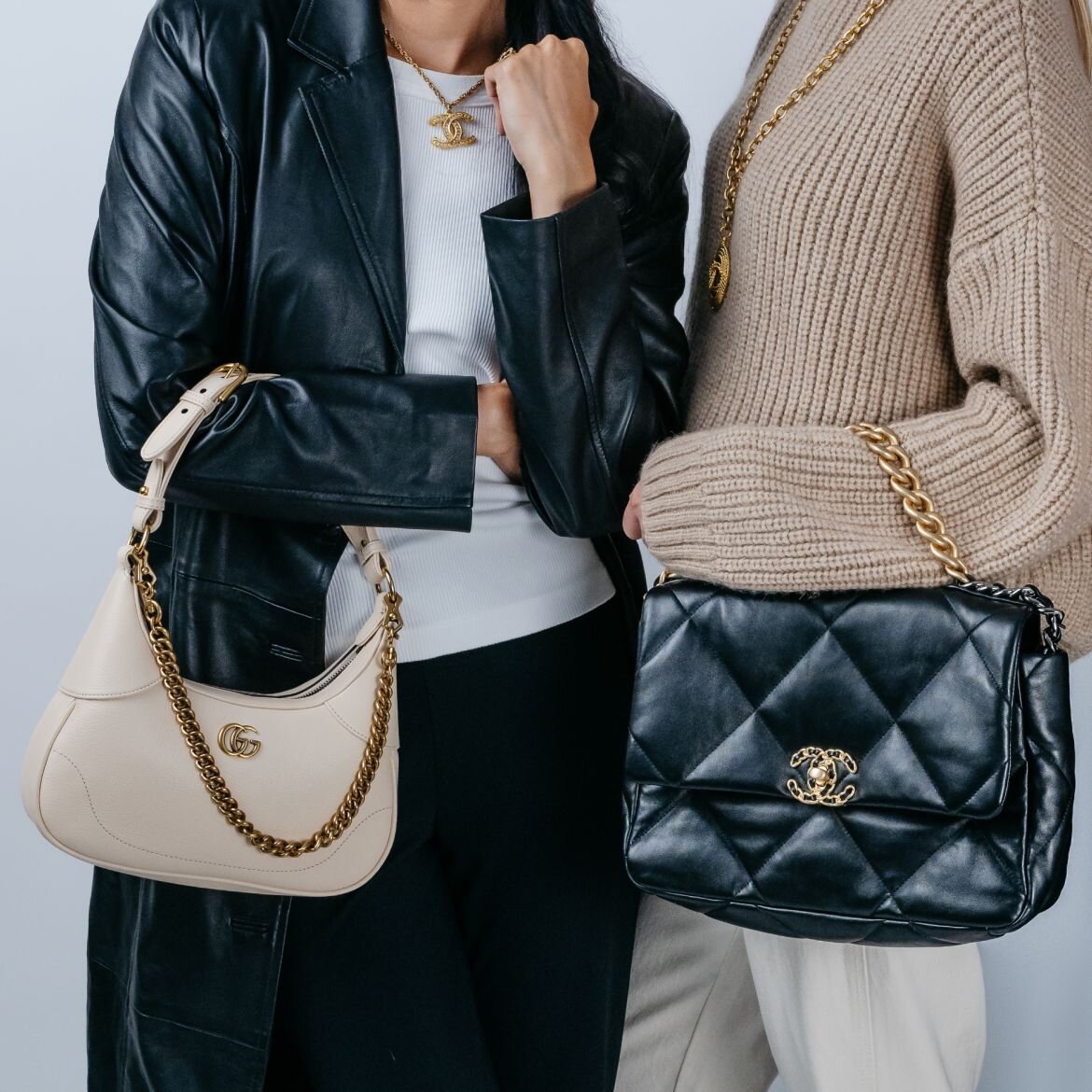 Image of women holding luxury handbags and wearing jewelry from Vivrelle.