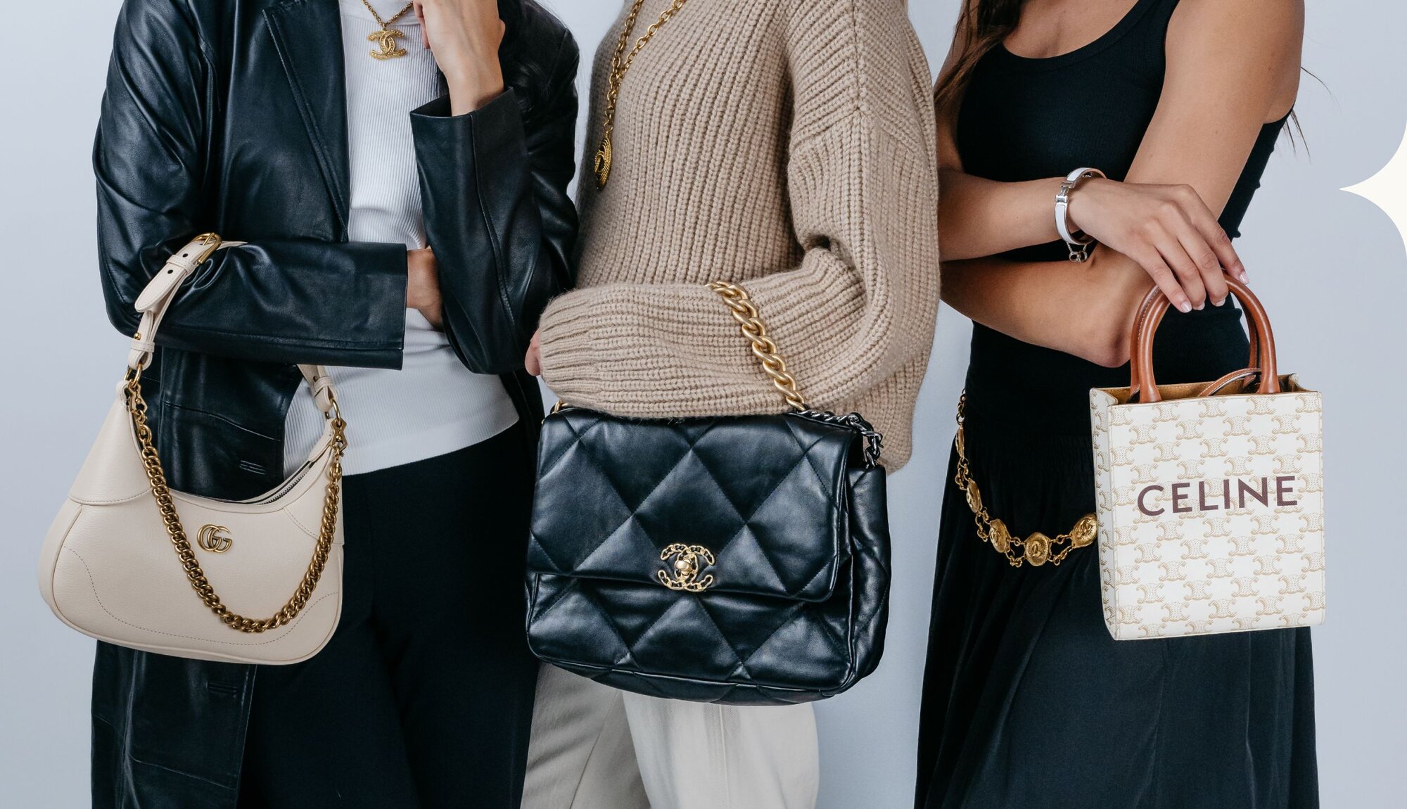 Image of women holding luxury handbags and wearing jewelry from Vivrelle.