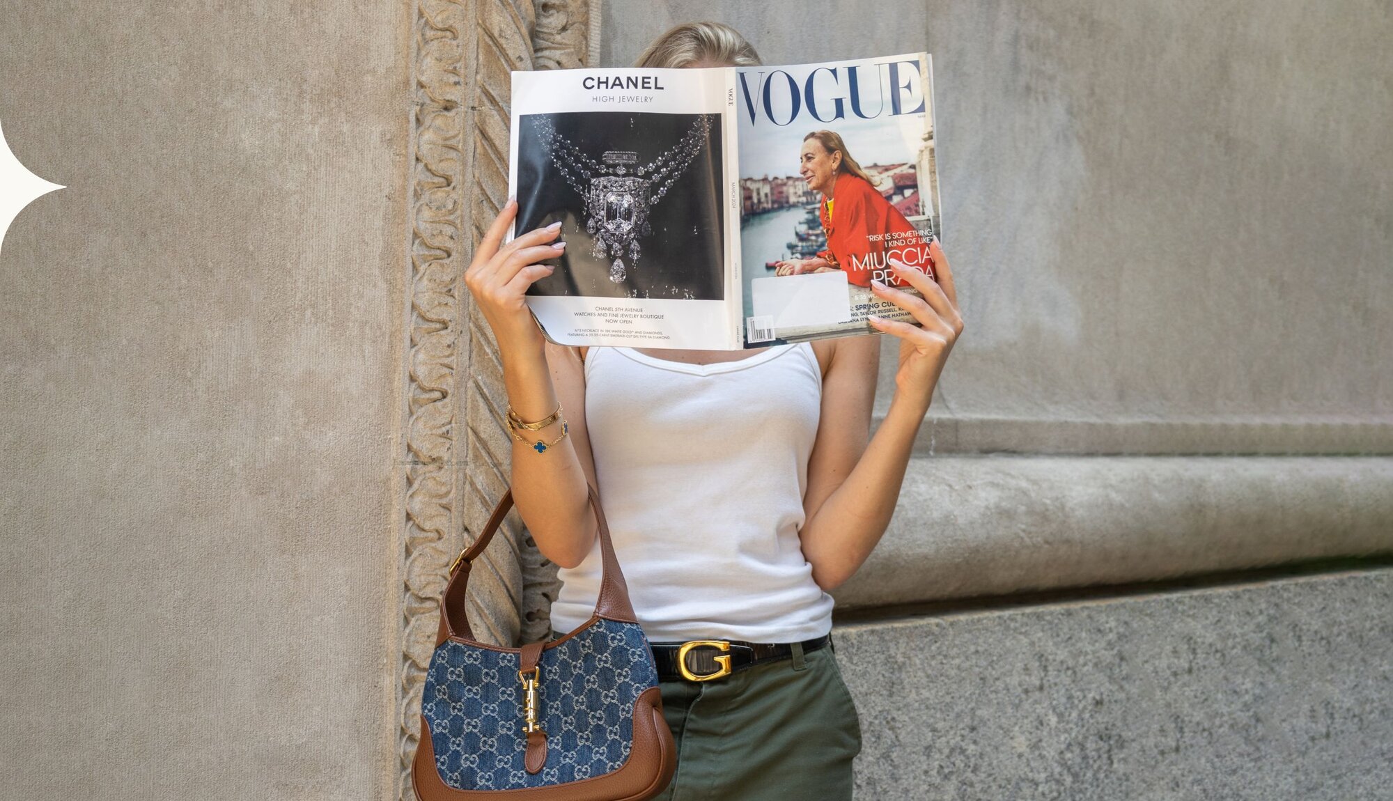 Image of women holding luxury handbags and wearing jewelry from Vivrelle.