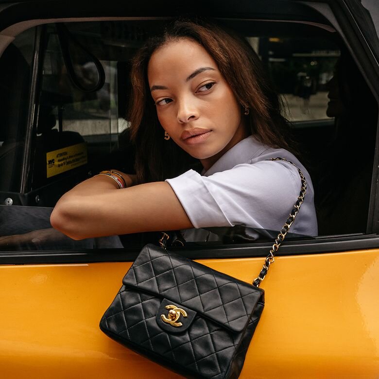 Woman carrying a luxury bag from Vivrelle in SoHo