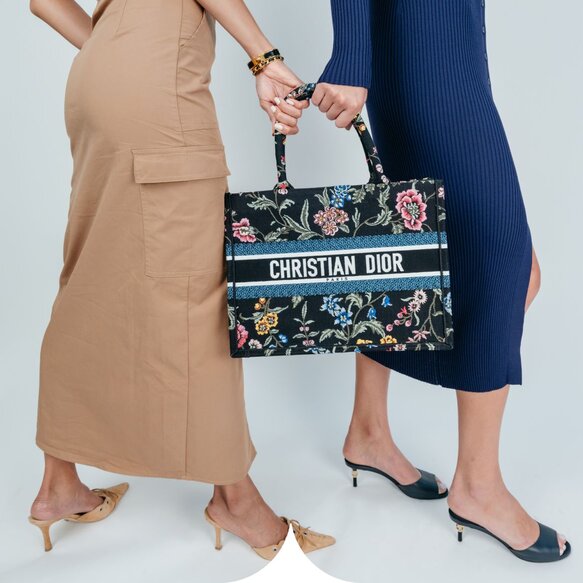 Photo of a beautifully decorated showroom showcasing a large array of luxury accessories from different brands.  