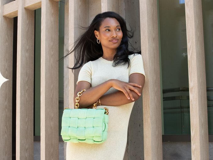 Photo of women holding a luxury bag from Vivrelle.