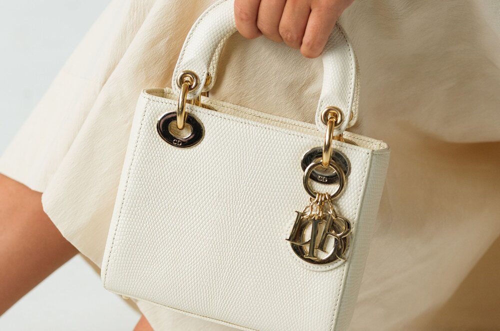 Actress Nina Dobrev with her favorite luxury handbags from Vivrelle. 