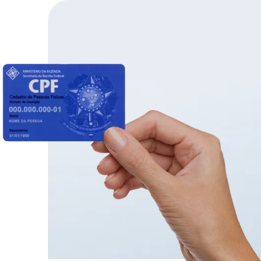 uma mão segurando uma cartão de CPF