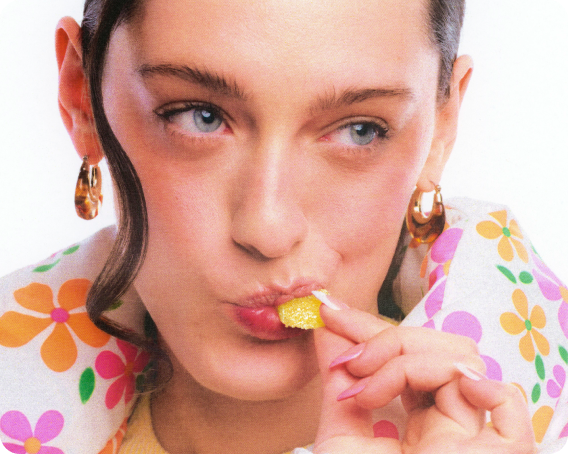 woman sucking on live rosin gummy