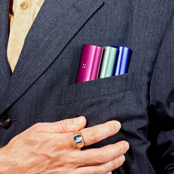 some pax plus vaporizers in a breast pocket of a suit