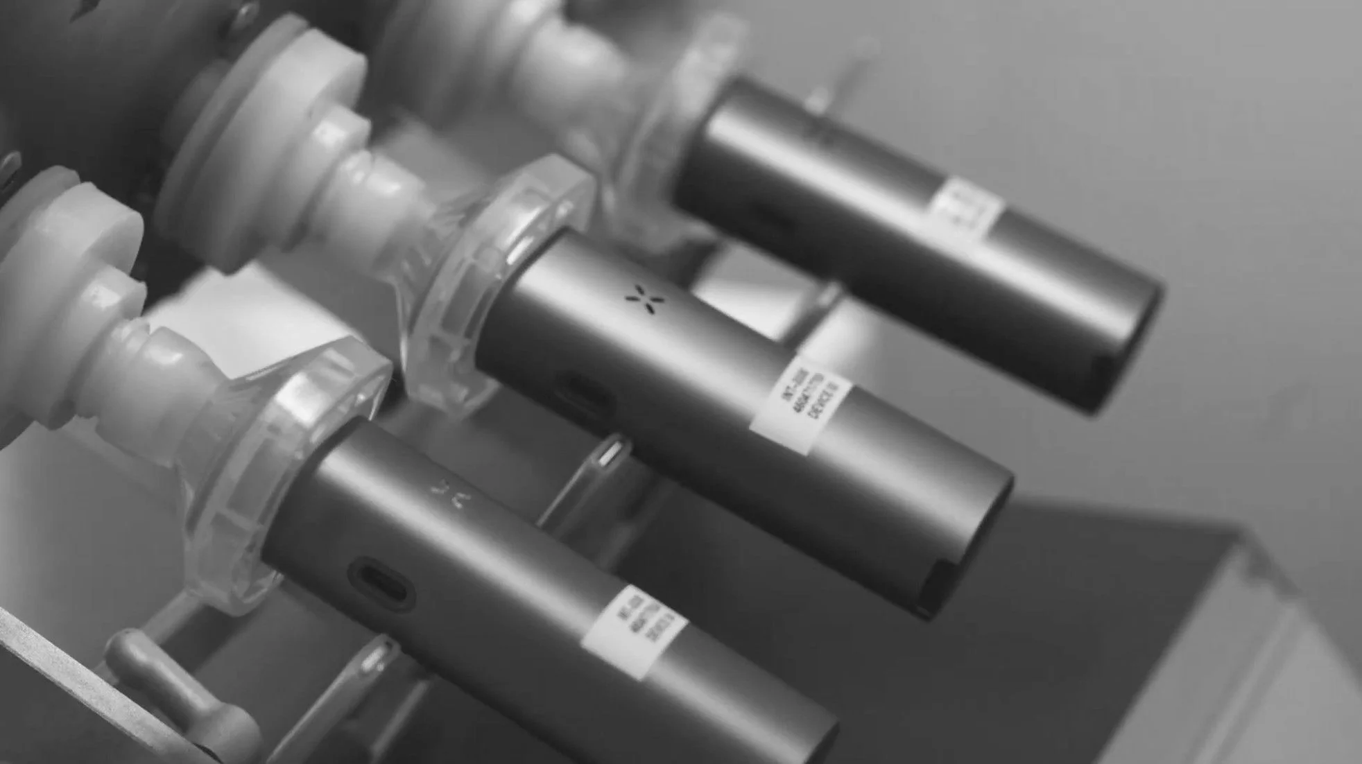 PAX Labs lab coats hanging on hooks