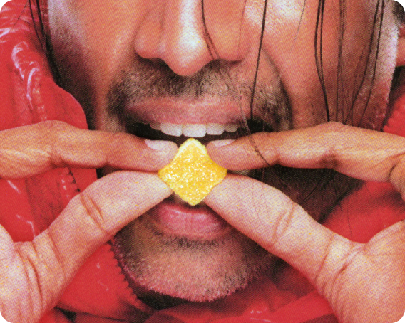 Man biting into pax live rosin gummy
