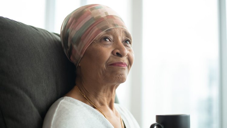 Chemo therapy patient with a head scarf on due to chemo related hair loss