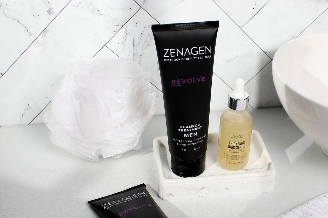 Revolve and Thickening hair serum on a bathroom counter
