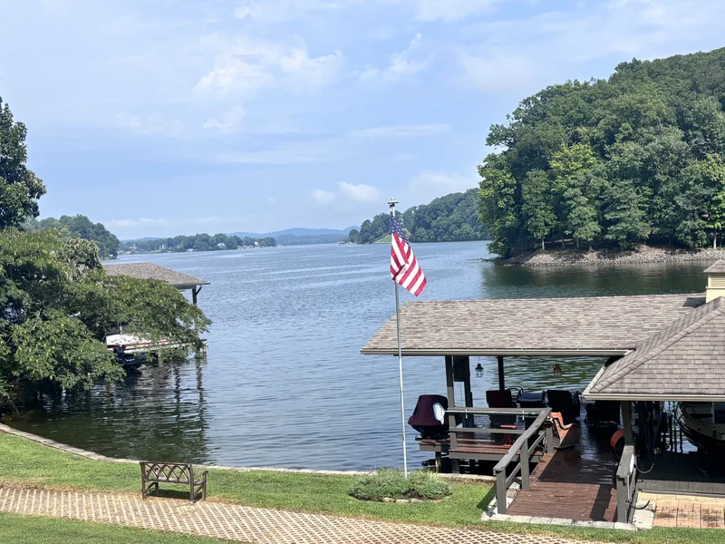 Lakefront yard and covered dock overlooking the water