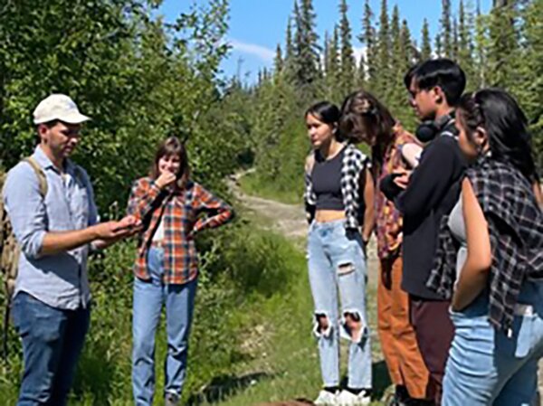 Muscarella (far left in cap), teaching at the 2022 RAHI Research program, Fairbanks, Alaska