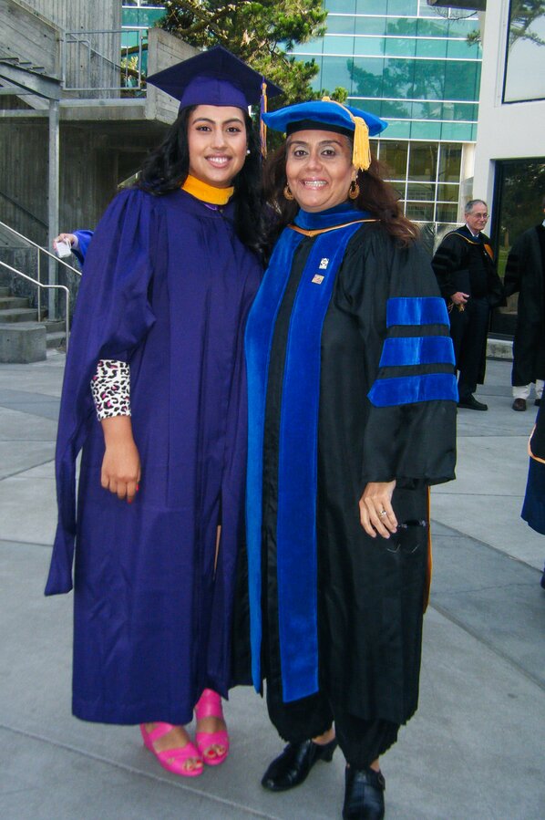 Cathy Samayoa, MS, with her thesis committee chair, Leticia Márquez-Magaña, PhD, at her graduation ceremony in 2011.