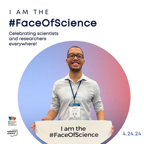 Keith Curry holding a sign with the message: I am the #FaceOfScience