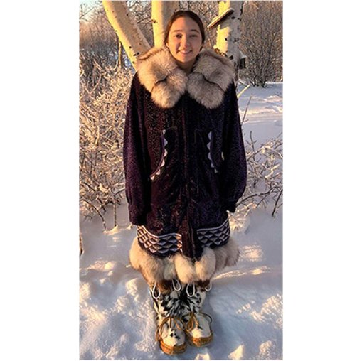 BLaST Scholar Tirzah Bryant in her traditional parka and kkakene (Koyukon word for fur boots), Galena, Alaska. (Photo credit P. Green, 2022) 