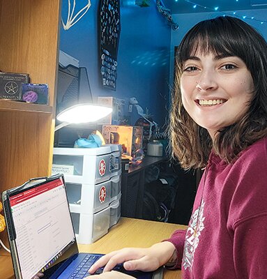 Julie-Anne Brown working on graphing at her desk at UAF, 2024.
