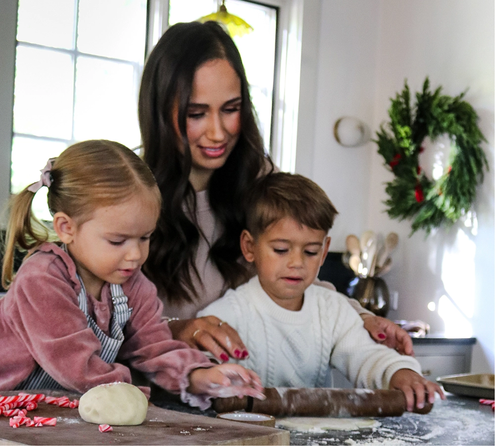 Truly Free Laundry Wash and refill pouch in a laundry room, with a woman and baby in the background.