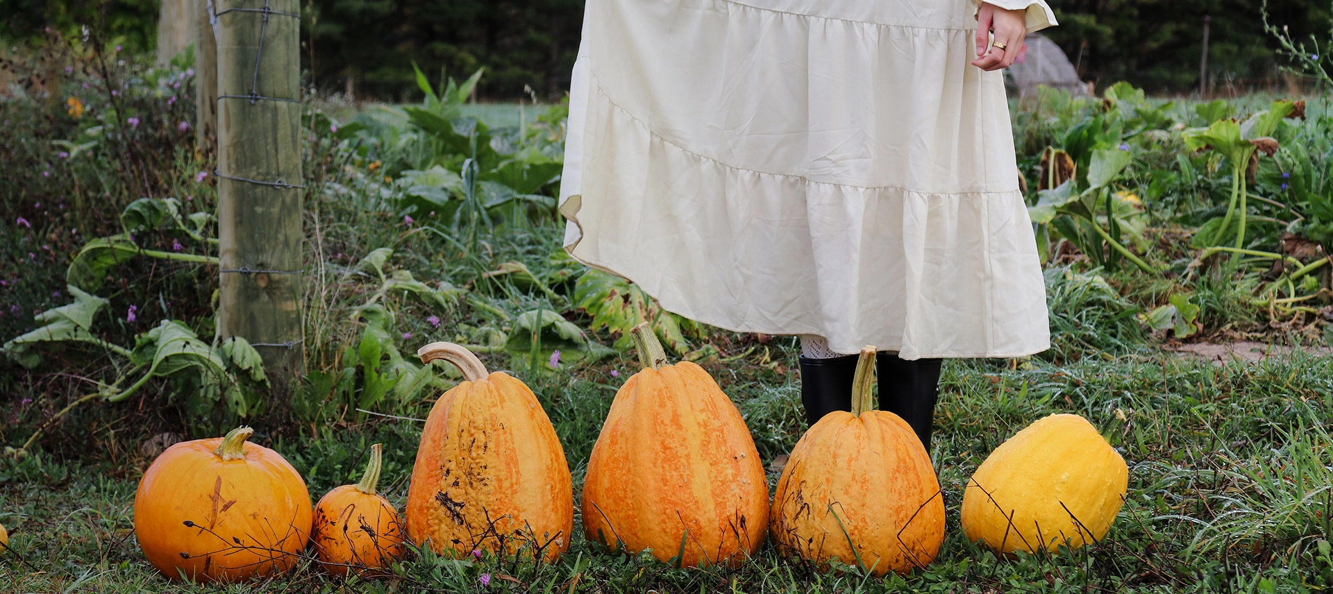 Truly Free Laundry Wash and refill pouch in a laundry room, with a woman and baby in the background.