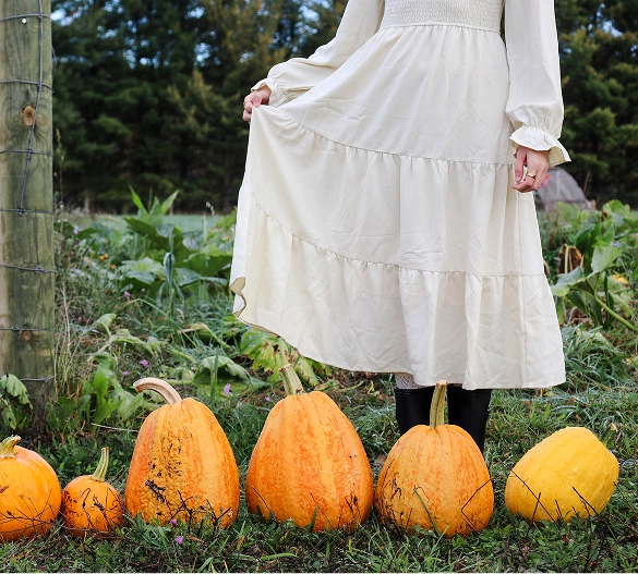 Truly Free Laundry Wash and refill pouch in a laundry room, with a woman and baby in the background.