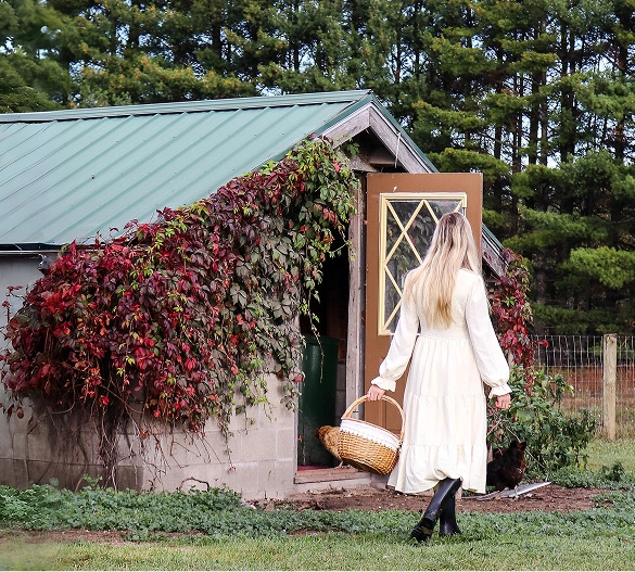 Truly Free Laundry Wash and refill pouch in a laundry room, with a woman and baby in the background.