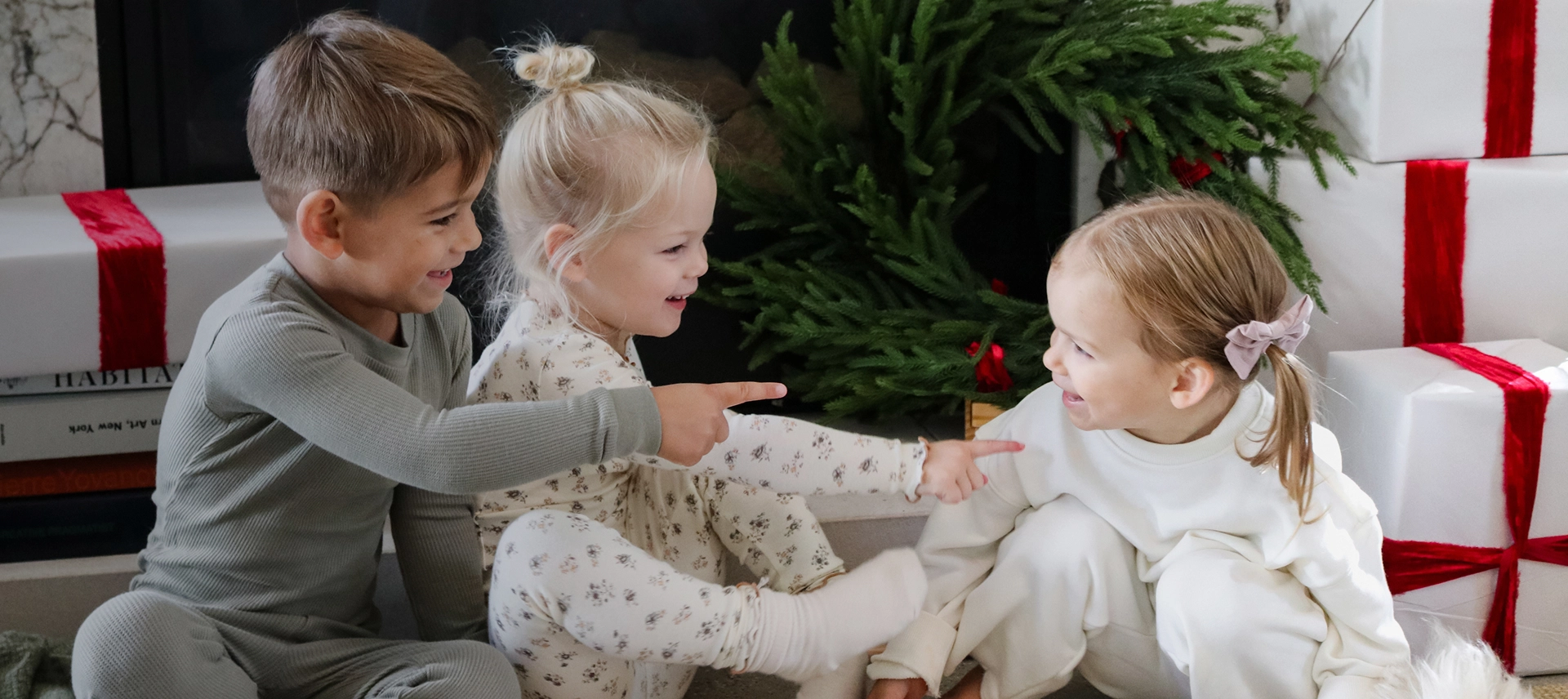 Truly Free Laundry Wash and refill pouch in a laundry room, with a woman and baby in the background.