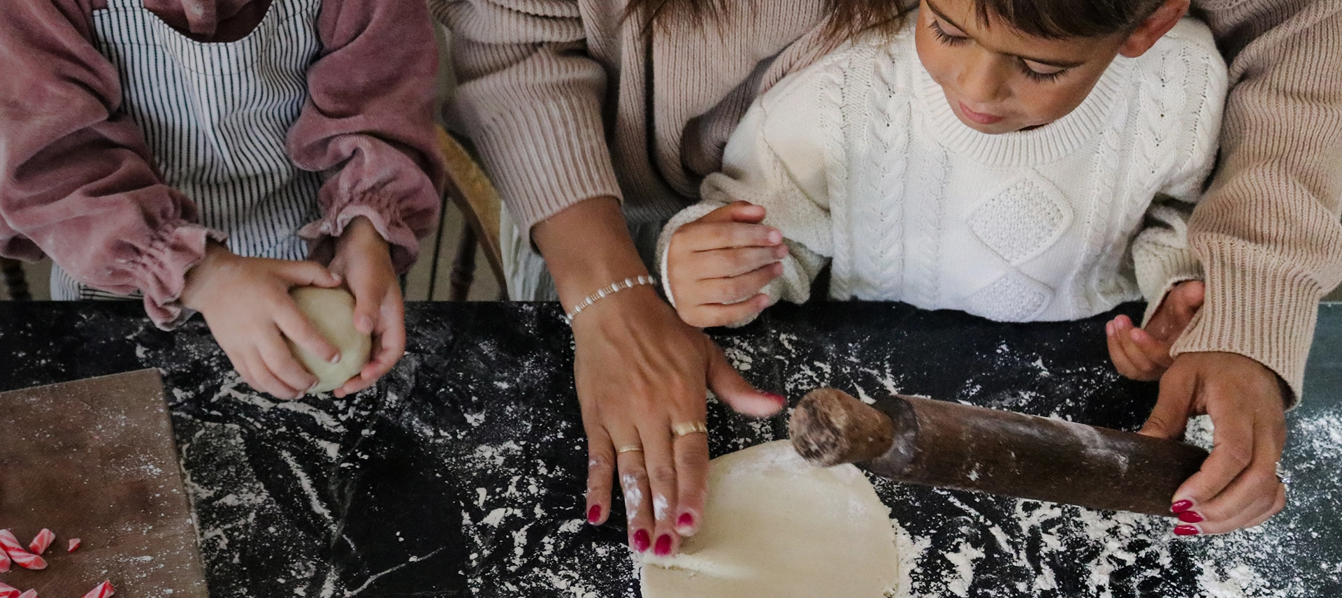 Truly Free Laundry Wash and refill pouch in a laundry room, with a woman and baby in the background.