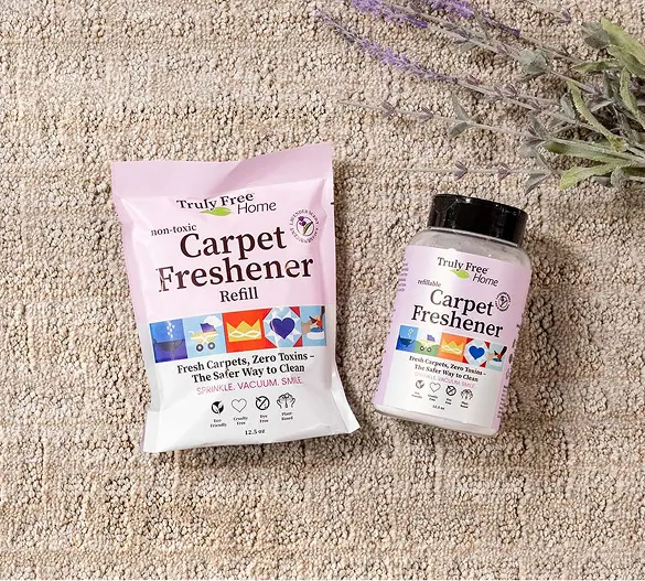 Truly Free Laundry Wash and refill pouch in a laundry room, with a woman and baby in the background.