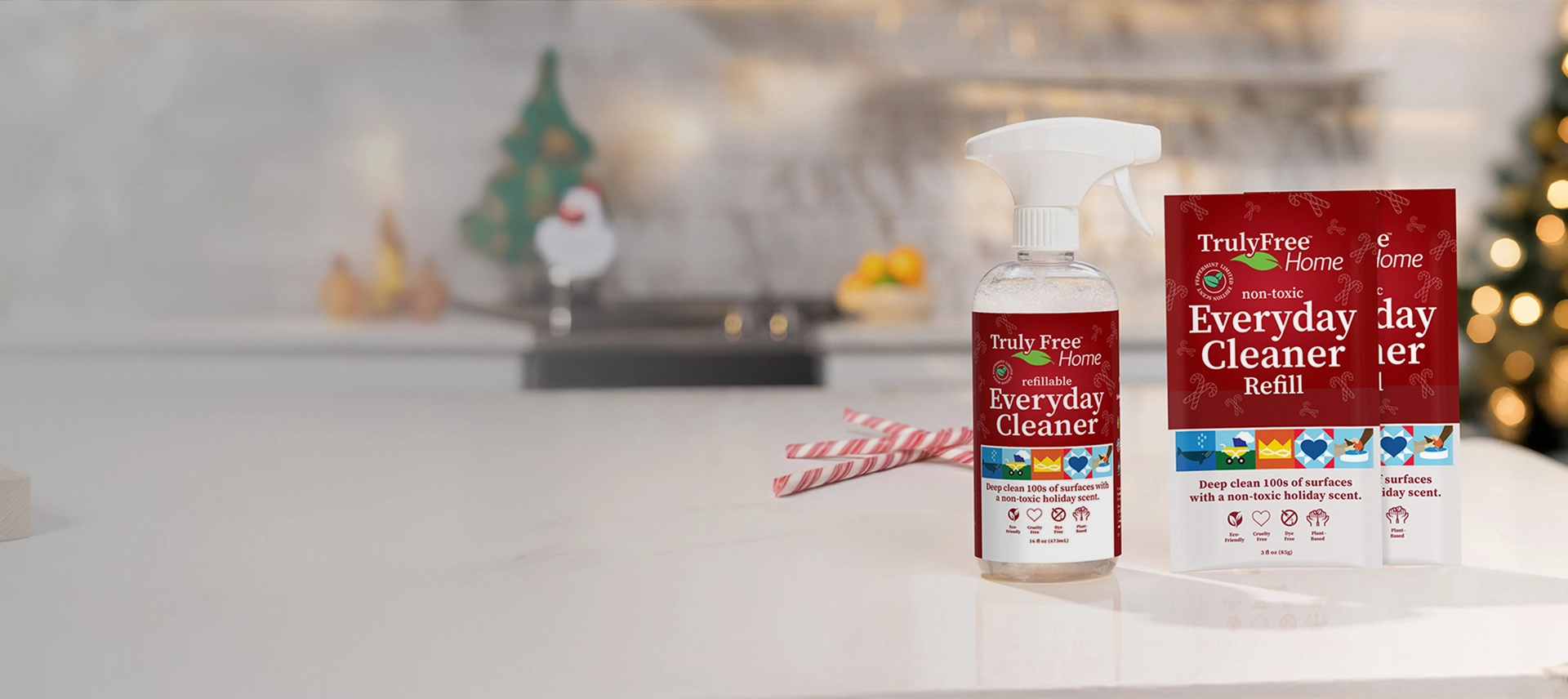 Truly Free Laundry Wash and refill pouch in a laundry room, with a woman and baby in the background.