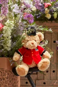 A teddy bear dressed as a royal guard at the Chelsea flower show