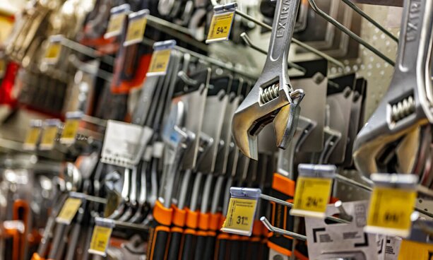Wrenches hanging in a hardware store aisle
