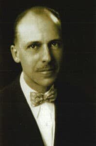 Early 1900s black-and-white portrait of Victor Vogel, a distinguished gentleman in formal attire.