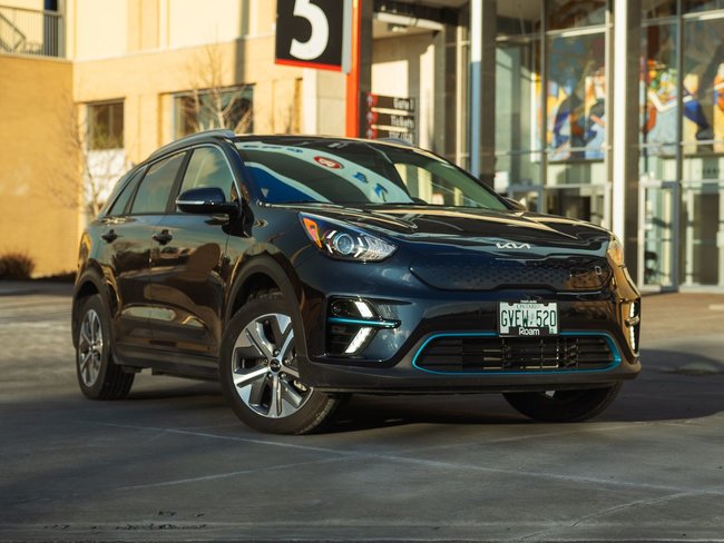 Roam Kia Niro in front of building