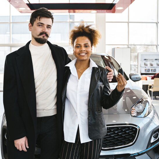 Woman calculating the cost of buying a car