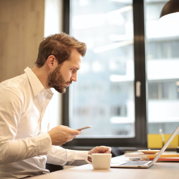 Businessman looking at his laptop