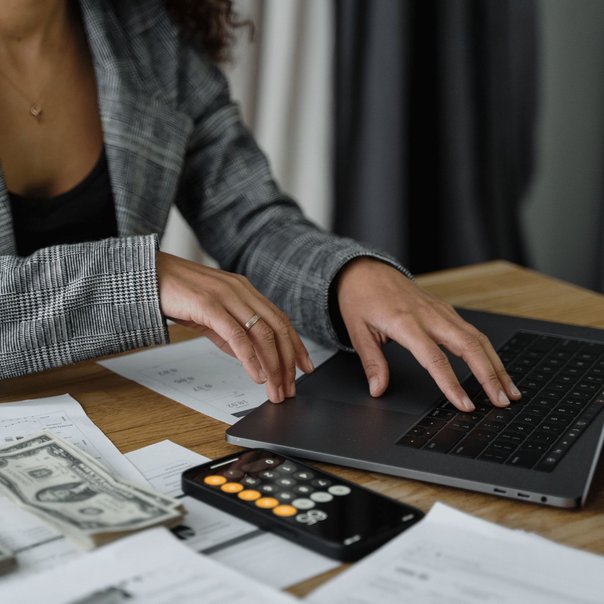 Woman calculating the cost of buying a car