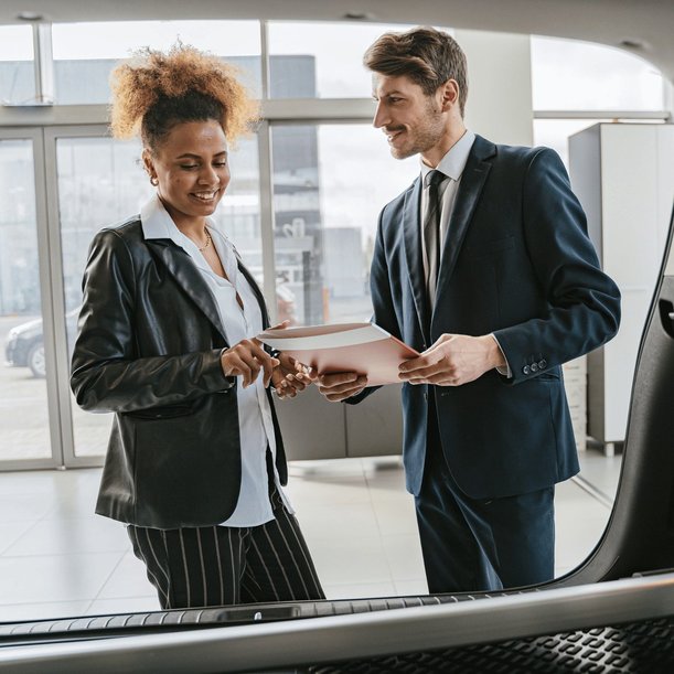 Woman buying a used car