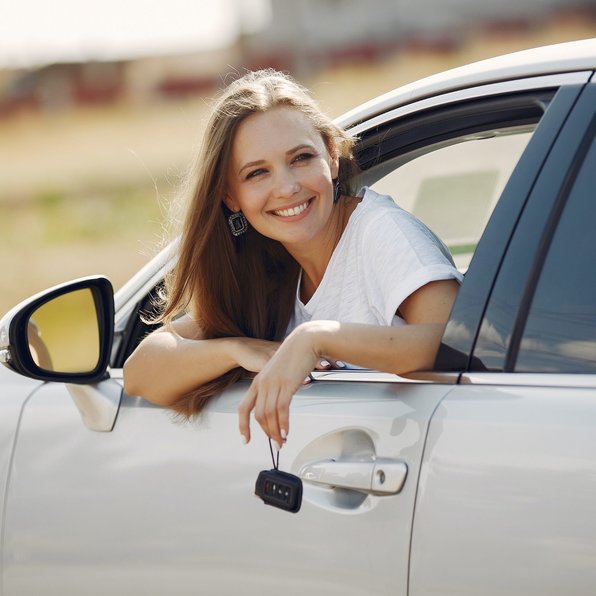 Car rental insurance woman in car sunny day