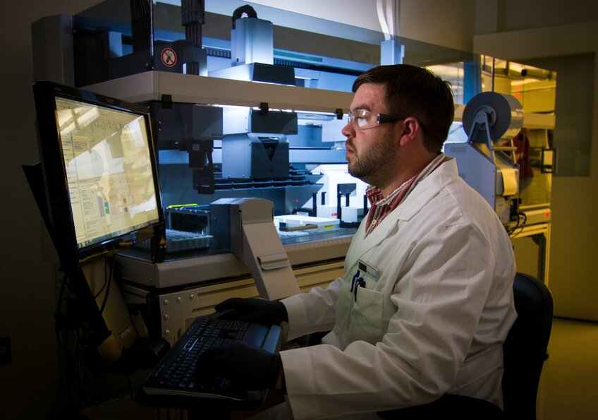 Scientist comparing data using Paired T-Test to find the difference between two variables for the same subject