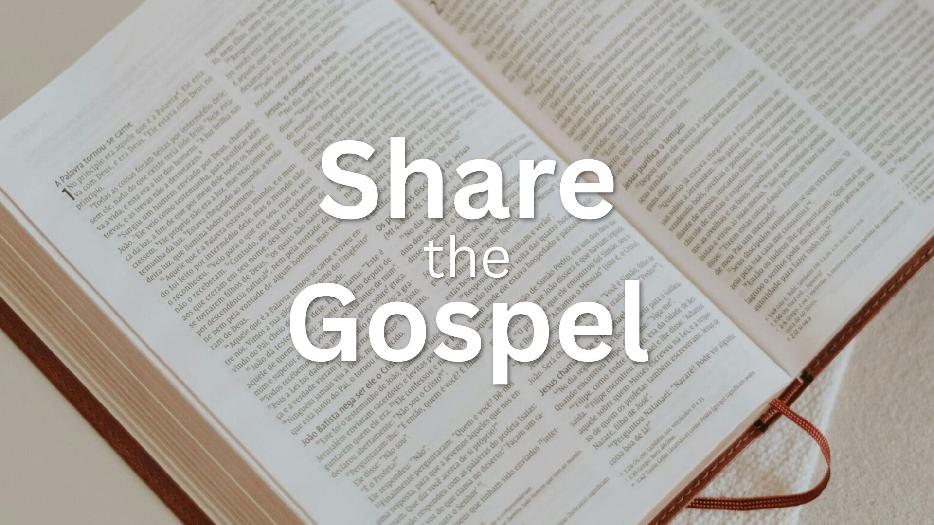Open Bible on table with text "Share the Gospel"