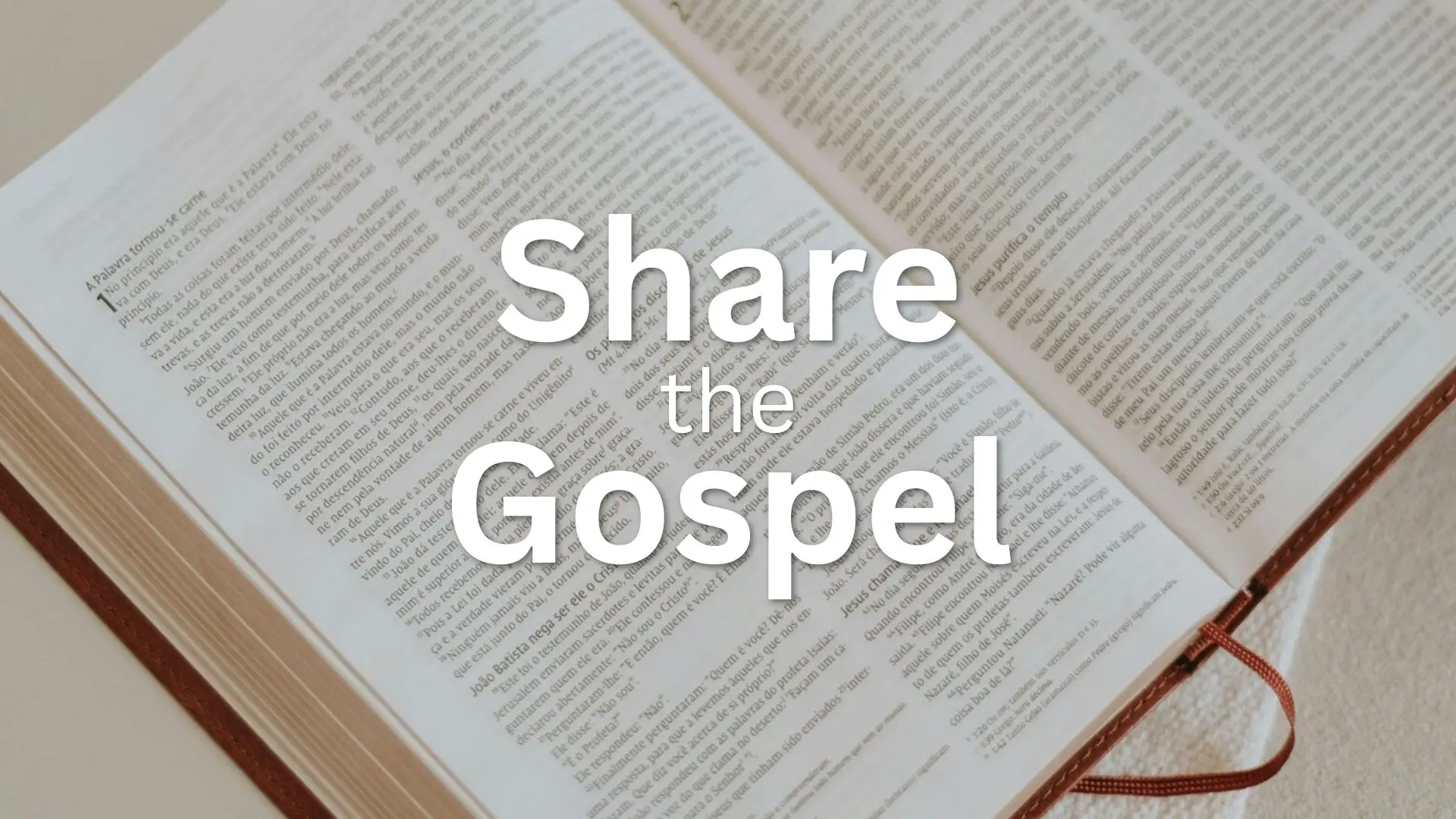 Open Bible on table with text "Share the Gospel"