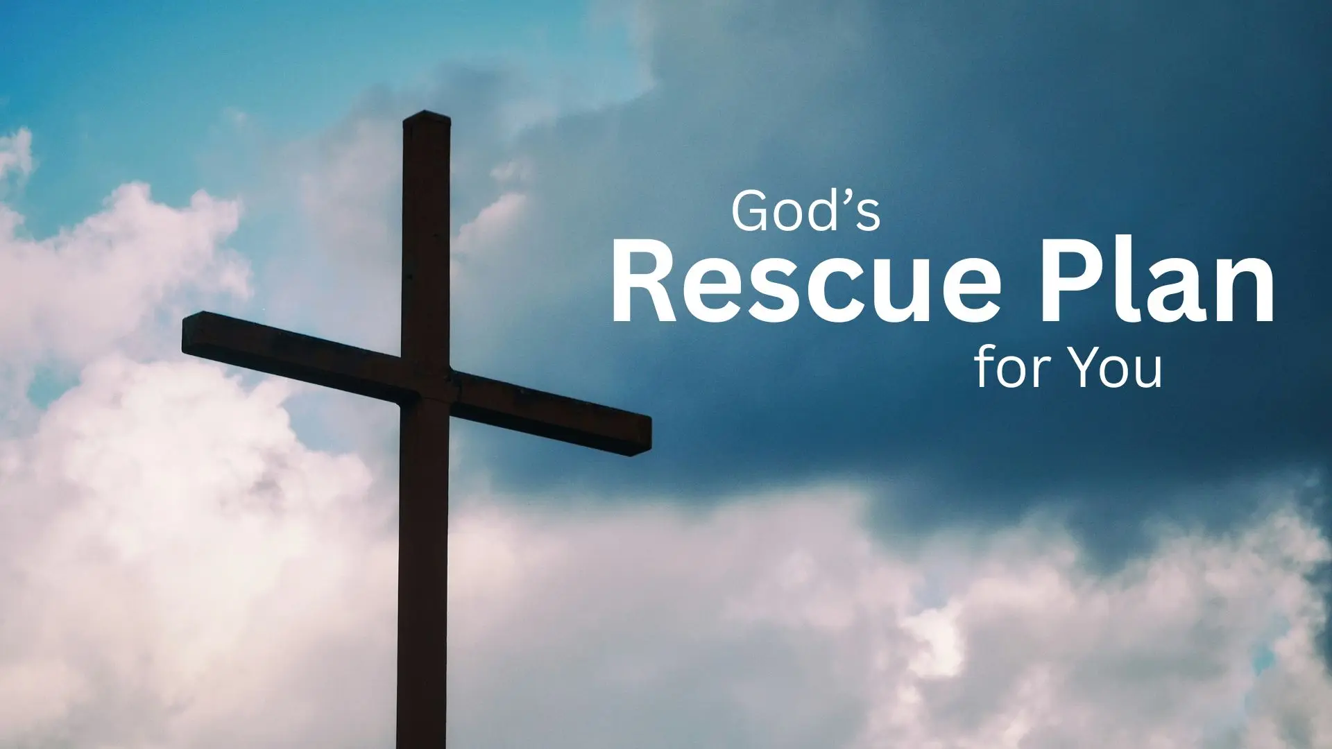 Silhouette of cross on cloudy blue sky