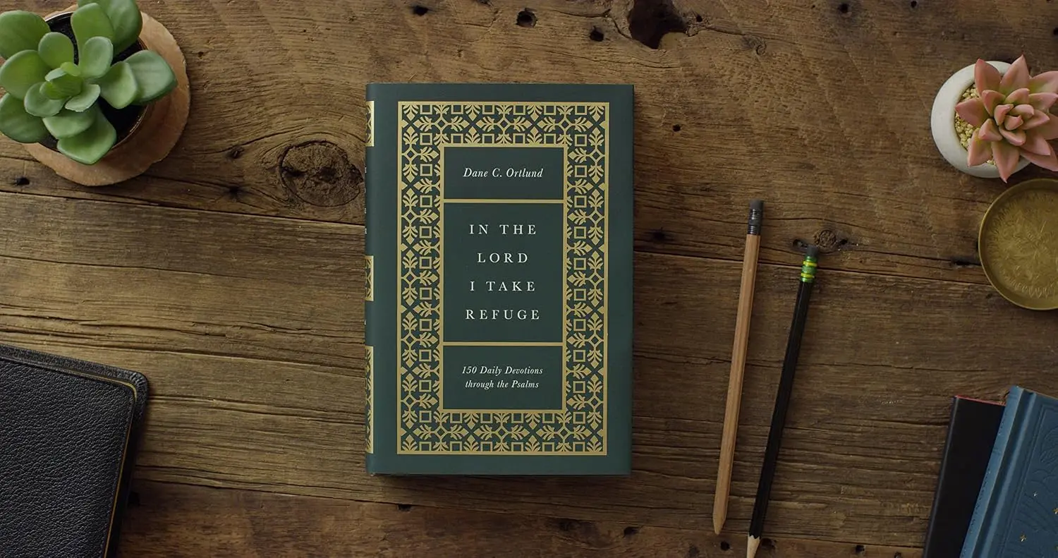 image of book with title "In the Lord I Take Refuge" surrounded by succulents and pencils