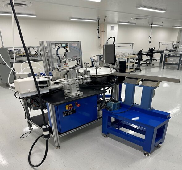 Photograph of a pick and place bead dispensing machine at Fortis manufacturing facility