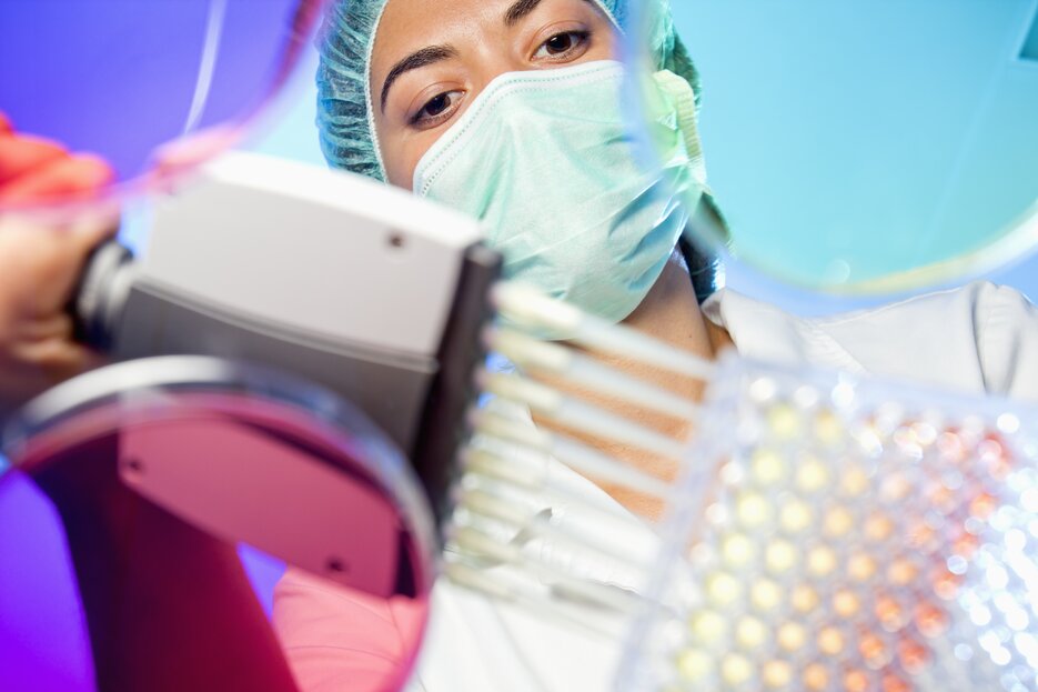 Scientist at Fortis conducting antibody discovery and manufacturing with quality lab control