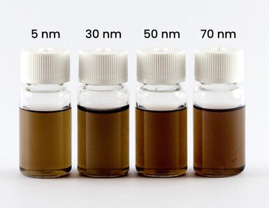 Four vials containing nanoparticle solutions labeled by size: 5 nm, 30 nm, 50 nm, and 70 nm.