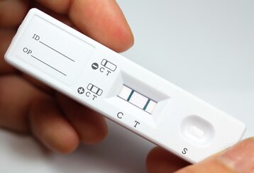 Diagnostic test kit image representing lateral flow assay