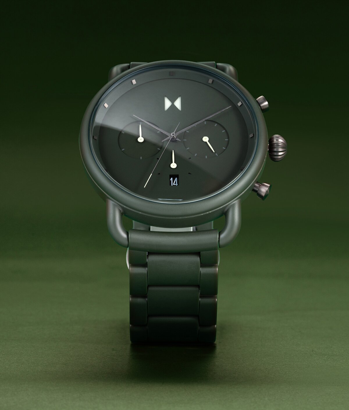 Green MVMT Blacktop ceramic watch standing upright highlighting its sporty style